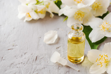 Fototapeta na wymiar Jasmine oil. Aromatherapy with Jasmine oil and soap. Jasmine flower