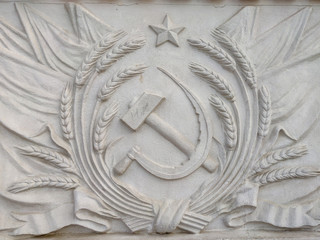 Bas-relief depicting the hammer and sickle of the USSR coat of arms