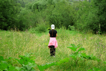 Girl among the green trees