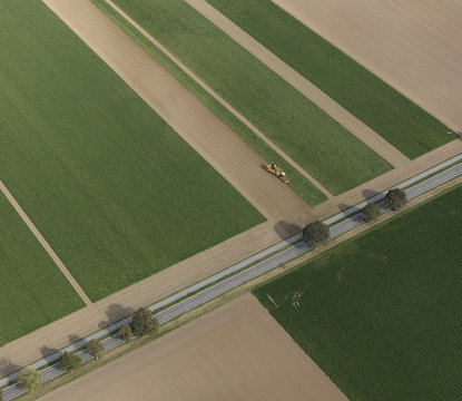 Aerial view combine harvester in agricultural crop, Hohenheim, Baden-Wuerttemberg, Germany
