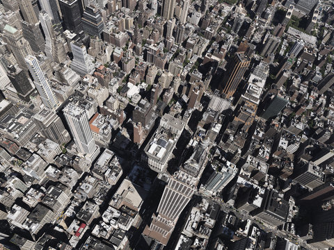 Aerial view Empire State Building towering above sunny city, New York City, New York, USA