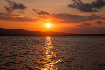 Beautiful evening sunset on the sea. Amazing sunset on black sea and beautiful cloudscape.