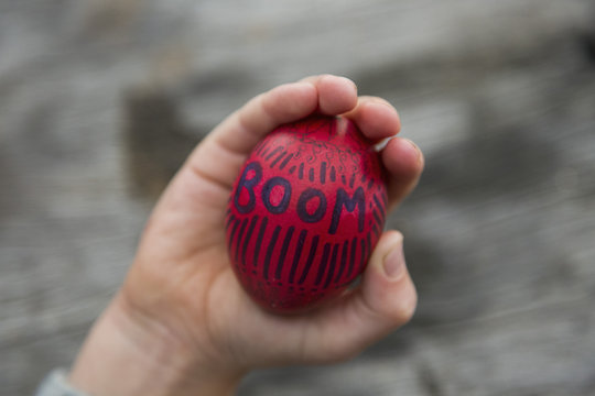 Personal perspective boy holding Easter egg