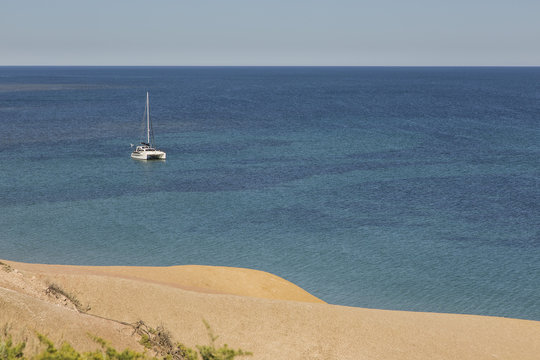 Catamaran on sunny, tranquil ocean, Port Willunga, South Australia, Australia
