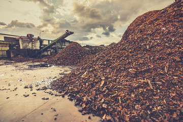 Outdoor pallet recycling sawmill plant for pellet processing using machinery