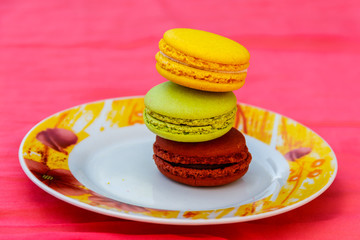 Tasty colorful macaroons in a plate