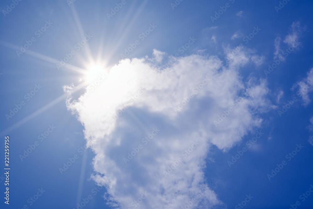 Wall mural blue sky with clouds and sun reflection.the sun shines bright in the daytime in summer