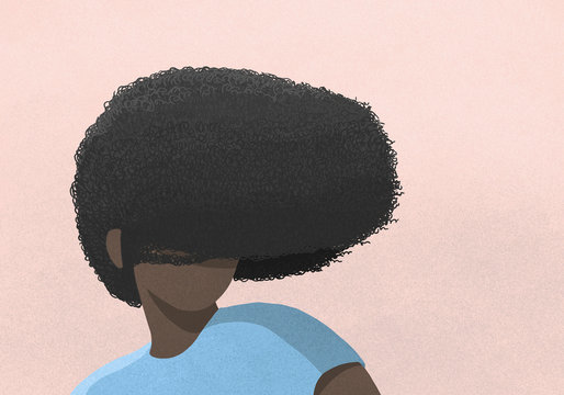 Woman's afro covering face on pink background