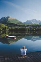 Alone man, Mountain landscape. Mountain lake. Outdoor recreation. Strbske pleso, Slovakia