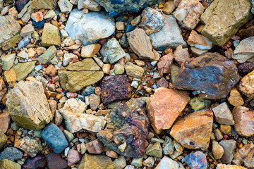 Colorful sea pebbles. rough sea stones, gravel texture of nature background and wallpaper. can be use for nature wallpaper,background, greeting card, advertizing, backdrop and board