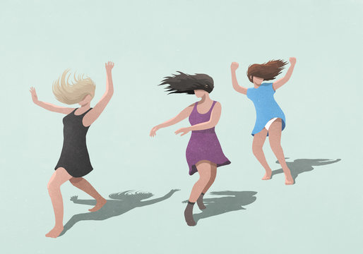 Carefree women in dresses dancing on blue background