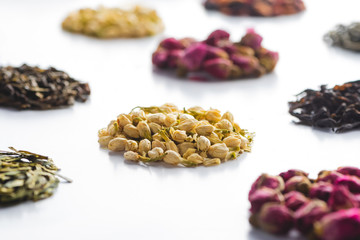 pattern of organic herbal dried tea on white tabletop