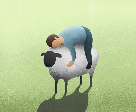 Man laying on top of lamb