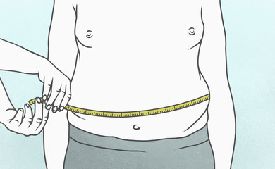 Overweight man measuring waist with tape measure