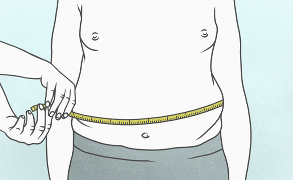 Overweight man measuring waist with tape measure