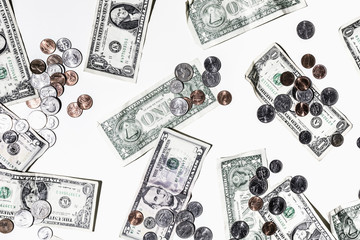 One and five dollar bills and coins on white background