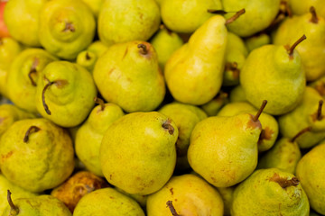 Pears in a box on the market.