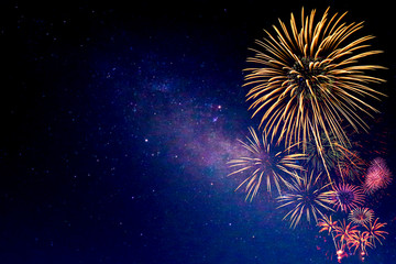 Fototapeta premium Fireworks with blur milky way background