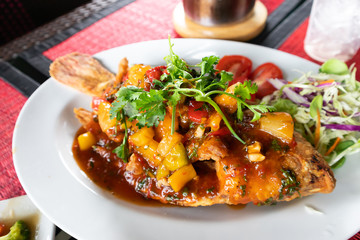 Fried Ruby Fish Topped with sauce
