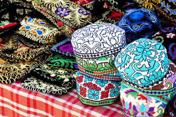 The traditional Uzbek cap named tubeteika, decorated with multi colored embroidery. Bukhara, Uzbekistan, Central Asia