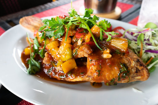 Fried Ruby Fish Topped with sauce
