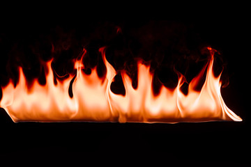 close up view of burning fire on black backdrop