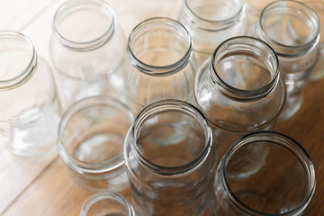 Empty Glass Jars On Wooden Floor
