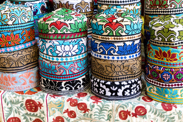 Fototapeta na wymiar The traditional Uzbek cap named tubeteika, decorated with multi colored embroidery. Bukhara, Uzbekistan, Central Asia