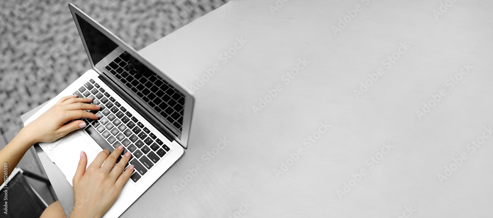 Wall mural website heading and banner of laptop with female typing hands, copy space in grey color. concept of 