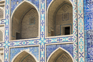 Madrasa facade in Bukhara, Uzbekistan.Traditional architecture. - obrazy, fototapety, plakaty