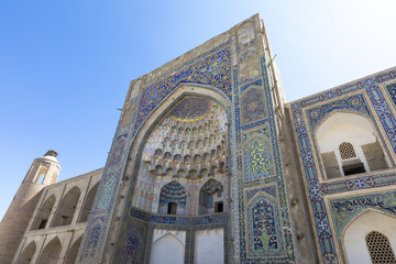 Madrasa facade in Bukhara, Uzbekistan.Traditional architecture.