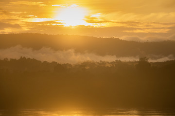 Landscape sunrise and mist at Mekong river beautiful morning golden hour between Thailand - Laos.