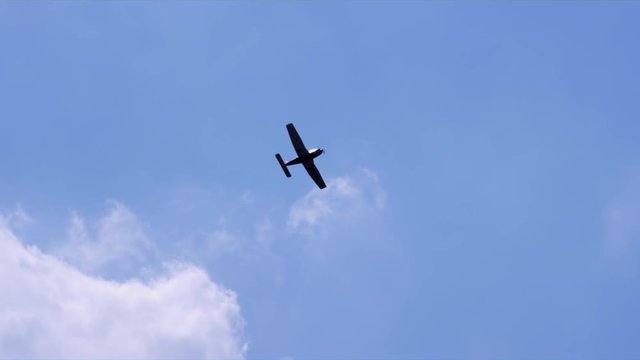 An Aircraft Flying Across the Blue Sky