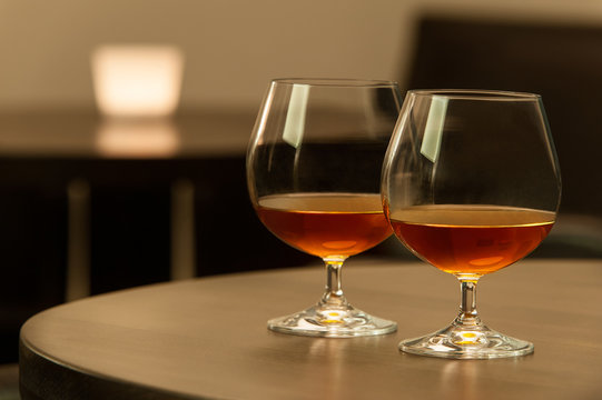 Two cognac glasses in the bar.