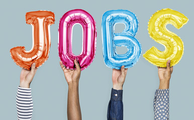 Hands showing jobs balloons word