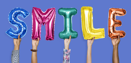 Hands showing smile balloons word