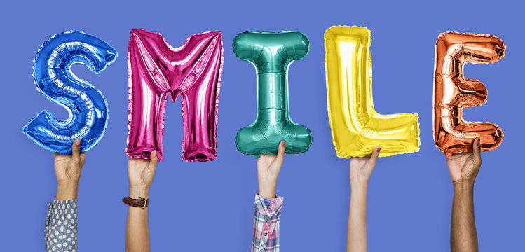 Hands showing smile balloons word
