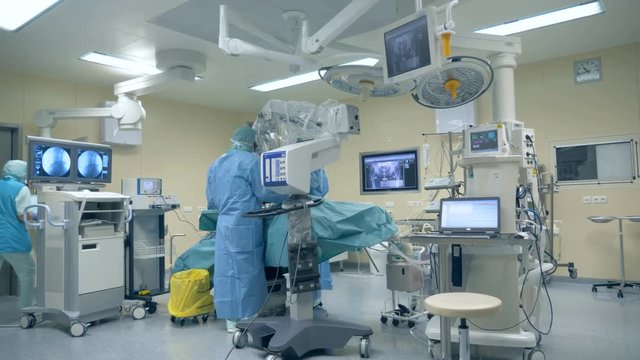 Surgical procedure is being performed in a fully-equipped medical room