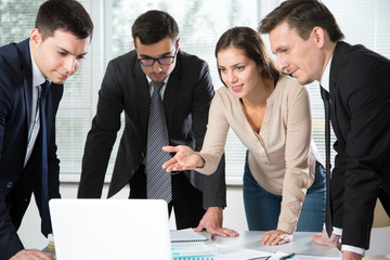 Business people discuss the project in the office