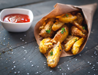 Close-up of roasted potatoes with rosemary, Parmesan cheese and fresh parsley on top