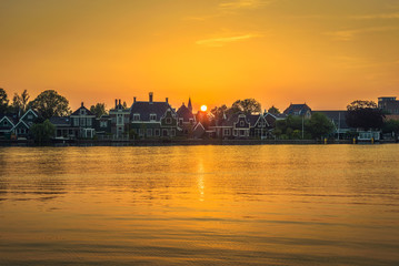 Naklejka premium Sunset above the beautiful village of Zaanse Schans in Holland