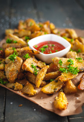Close-up of roasted potatoes with rosemary, Parmesan cheese and fresh parsley on top