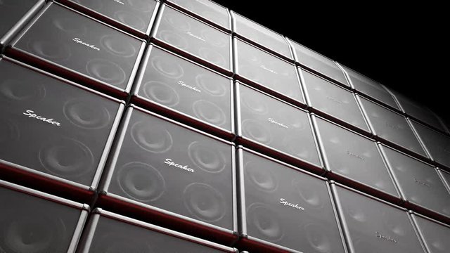 Playing cabinet speakers stacked on a stage in form of an endless wall pattern.