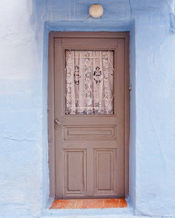 Greek island, brown door and blue wall