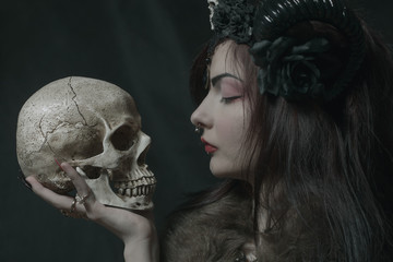 Horned girl with skull