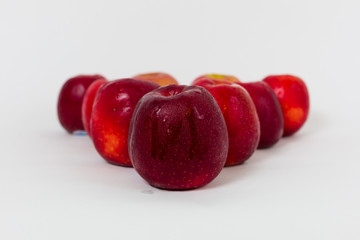 Red apples on the white background 