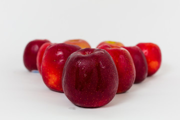 Red apples on the white background 