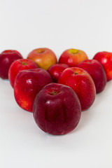 Red apples on the white background 