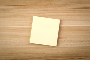 Blank Sticky Note On The Wooden Table