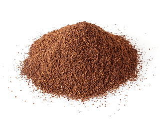 Heap of ground roasted coffee beans isolated on white background